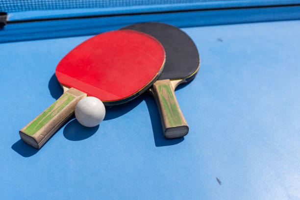 istock table tennis ball and paddle 2150806874