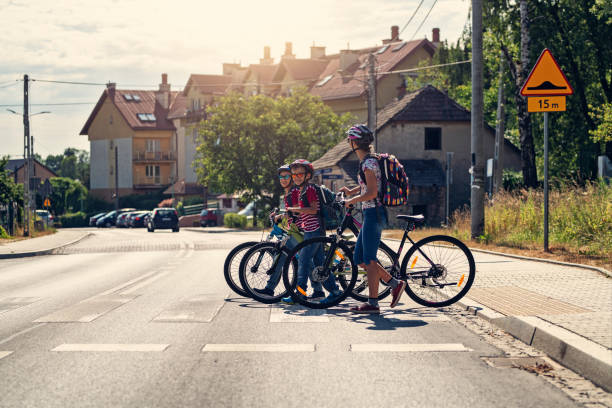 istock Three kids riding to school on bikes 2150807963