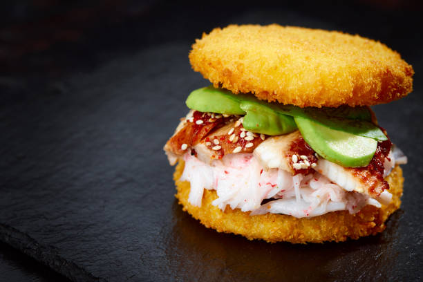 istock sushi menu with burger made from rice and smoked eel, avocado, light cheese and nori 2150808458