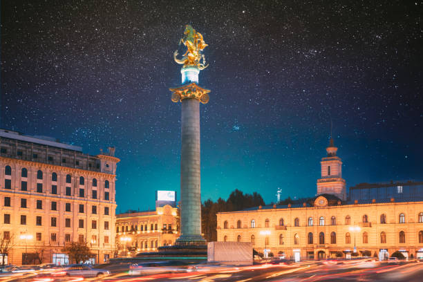 istock Tbilisi, Georgia, Eurasia. Amazing Bold Bright Blue Starry Sky Gradient Above Liberty Monument Depicting St George Slaying The Dragon And Tbilisi City Hall In Freedom Square In City Center 2150810302