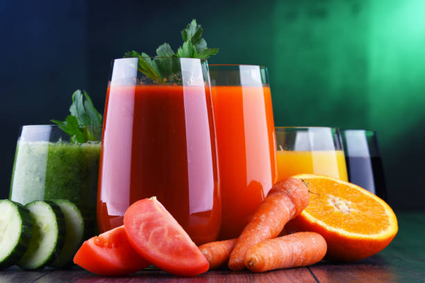 Glasses with fresh organic vegetable and fruit juices