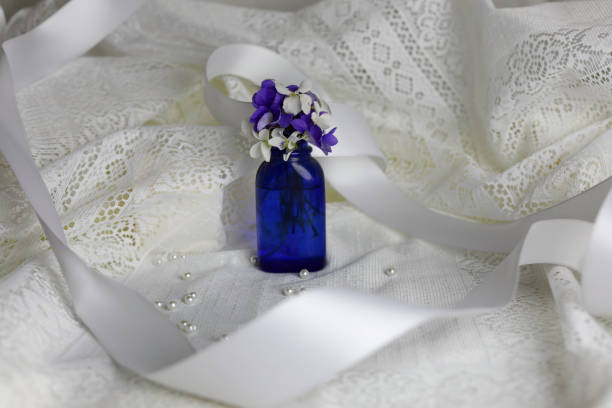 White lace, ribbon and pearl beads.