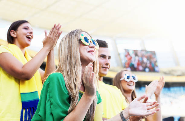 istock Soccer fans cheering and clapping, with copy space 2150812109
