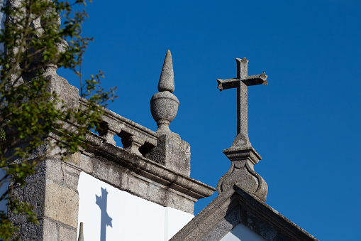 Stone Crucifix against a vibrant Blue Sky, Fao, Braga, Portugal.