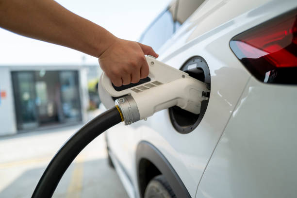 istock Handheld charging plug to charge the car 2150818908