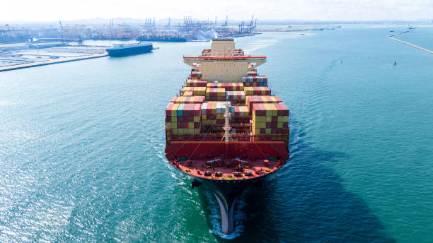 istock Front view Cargo Container ship the ocean ship carrying container and running for import export concept technology freight shipping by ship. Container Vessel running out from international customs. 2150818945