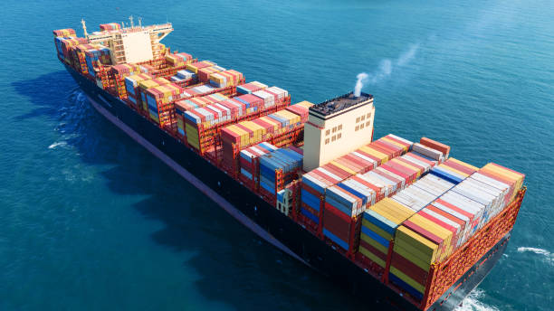 istock Stern Cargo Container ship the ocean ship carrying container and running for import export concept technology freight shipping by ship . aerial top of Container Vessel running in green sea 2150818969