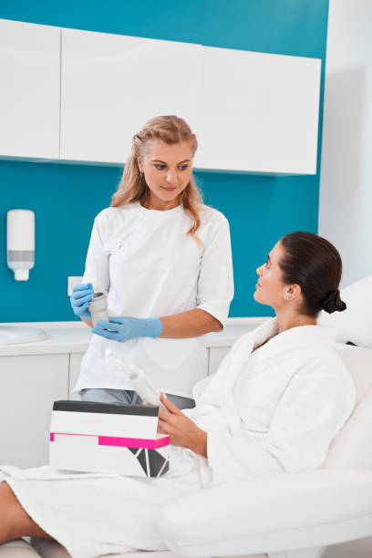 istock Doctor demonstrating plasmolifting kit for patient 2150819823