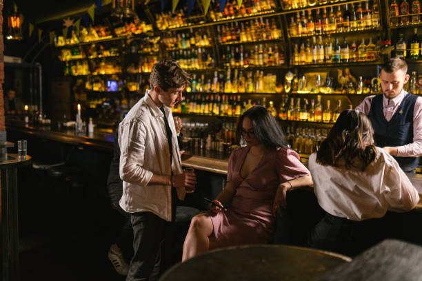 istock Handsome man interests in lady in trendy restaurant at night 2150819908