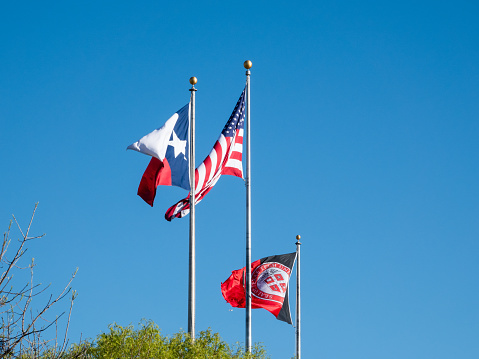 Lubbock, Texas, USA- April 11, 2024: Flags over a central quad, Texas Tech University.