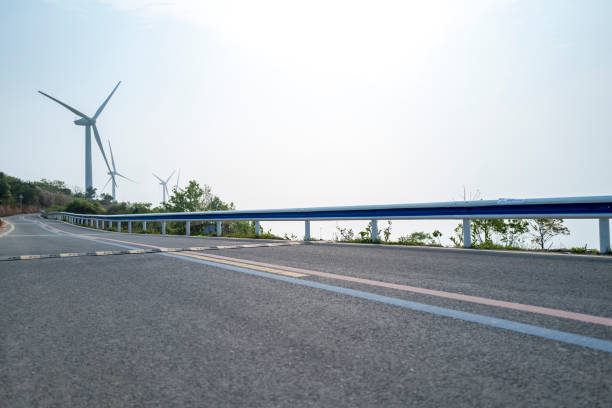 Turbine next to empty asphalt road