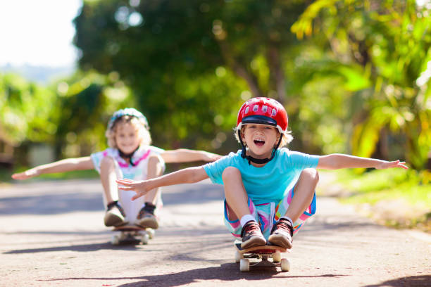 istock Kid with skateboard. Child riding skate board. 2150822390