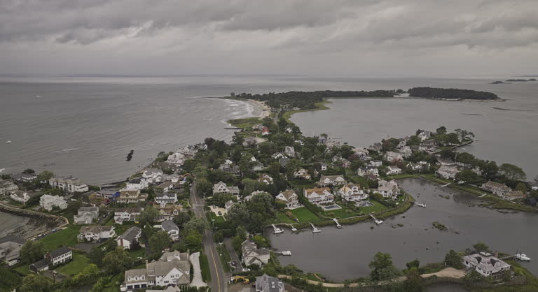 Stamford Connecticut Aerial v8 drone flyover charming coastal village of Old Greenwich neighborhood capturing waterfront properties and community park - Shot with Mavic 3 Pro Cine - October 2023