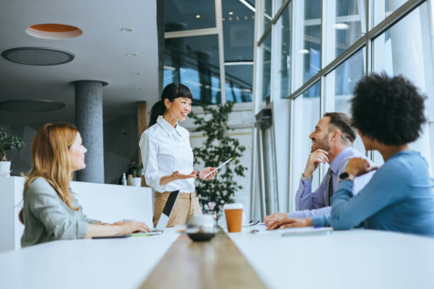 istock Dynamic team meeting with female speaker 2150826062