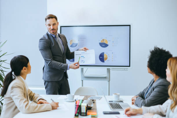 istock Businessman presenting to colleagues in boardroom 2150826137