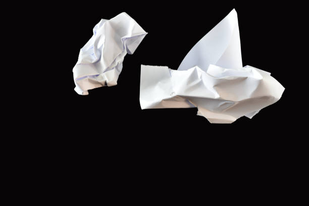 istock Paper lumps lie chaotically on a black background. 2150826508