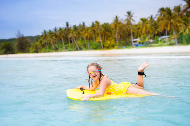 istock Kids playing on beach. Children play at sea. 2150827098