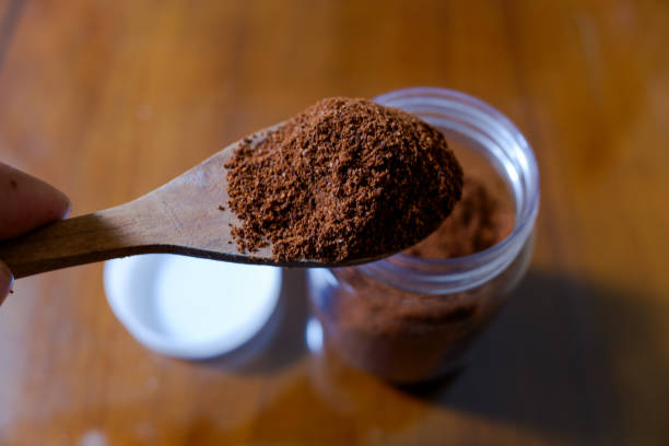 istock One spoon of coffee powder, with table background 2150828265
