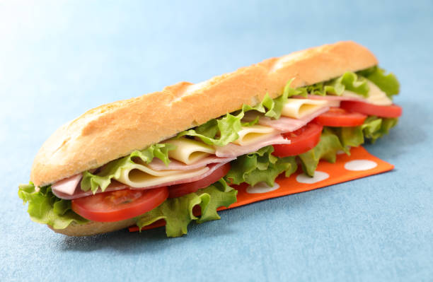 istock baguette sandwich with cheese, ham, tomato and lettuce 2150830488