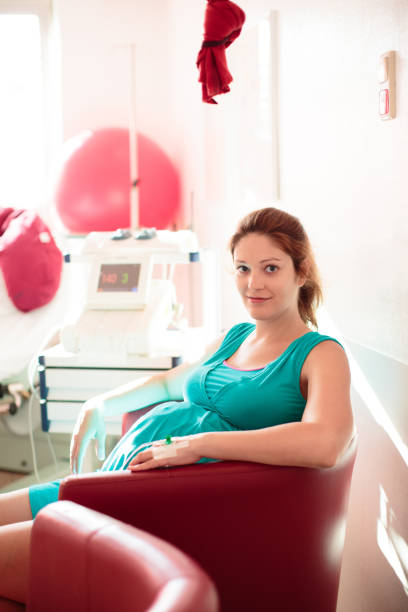 istock Young mother giving birth to a baby 2150831106