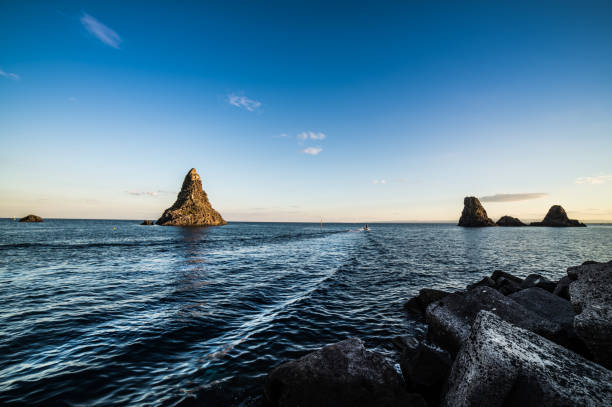 sunset over the sea, sea stacks of acidity. blu sea.