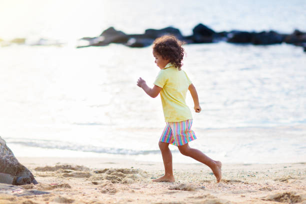 istock Little boy playing on tropical beach. 2150831852