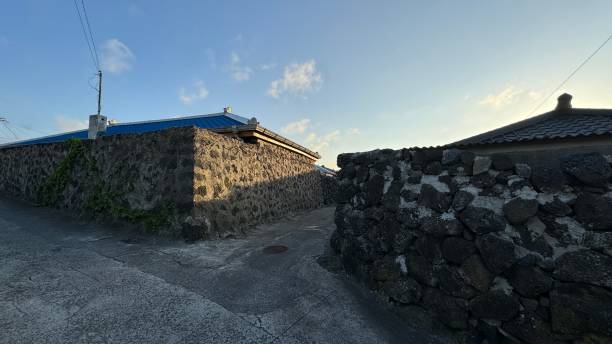 istock Narrow road between stone walls 2150832318