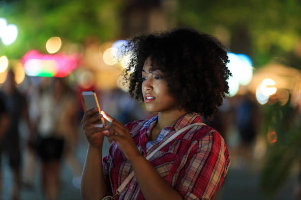 istock Woman texting on phone at night 2150835563