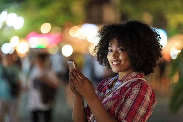 istock Woman texting on phone at night 2150835590