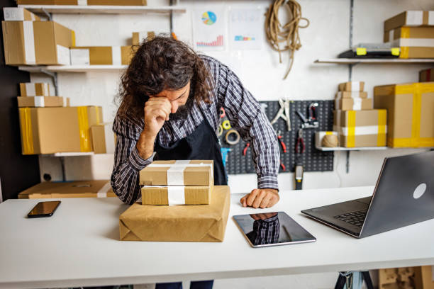 istock Worried man works in online store 2150839909