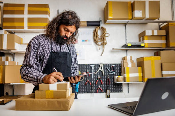 istock Salesman labeling products for customers in online store 2150839978