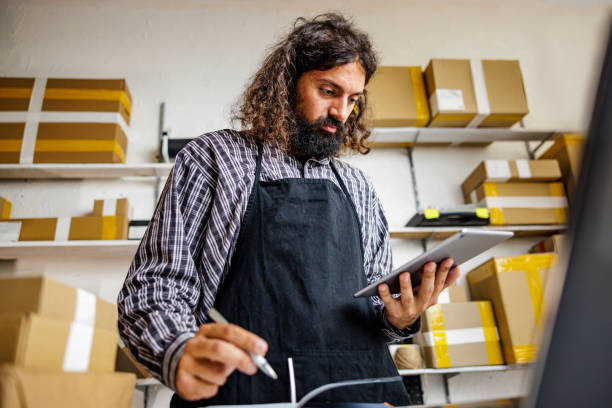 istock Man works in online store 2150840005