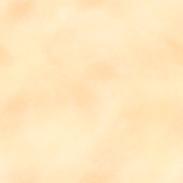 istock Paint washes, a peach color stain, orange, beige, airy, translucent, with soft, blurry edges. Hand drawn watercolor illustration. seamless pattern 2150840401