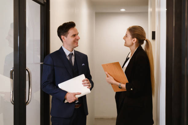 istock financial business team working analyst on stock market exchange technical graph trend. trader broker investor meeting at night. businessman talking with research team in risk and investing report. 2150844589