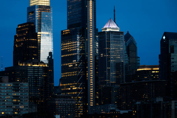 A beautiful vibrant view of the city of Philadelphia, Pennsylvania at nighttime, the lights of the skyscrapers and building glowing brightly.