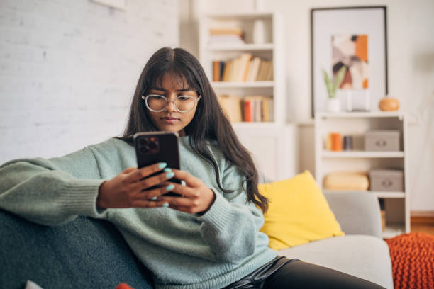 istock Woman focused on her mobile phone 2150846722
