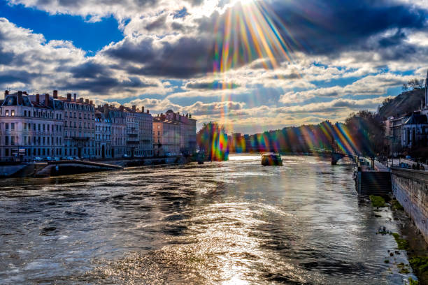 Soane River Buildings Tour boat Rainbow Reflection City Center Lyon France.