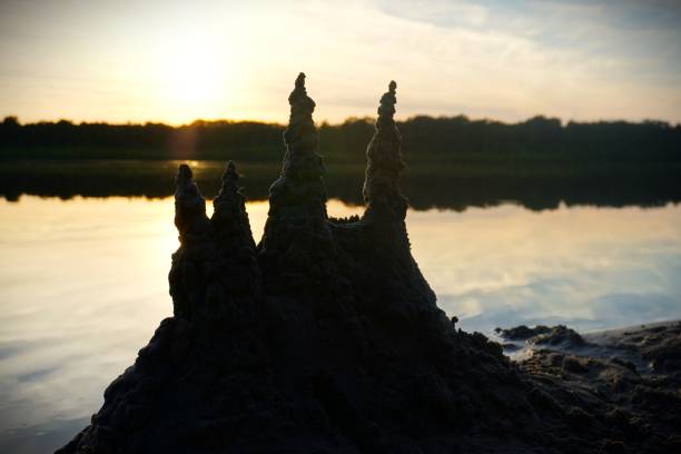 sandcastle at lake with sunset
