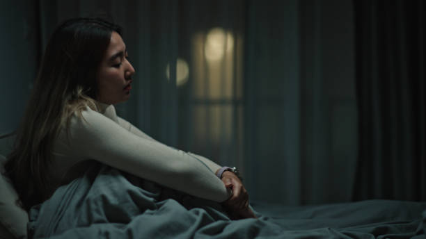 istock Woman depression and anxiety at night. 2150860078
