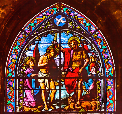 Saint John Baptizing Jesus Stained Glass Saint Nizier Church Lyon France. Church built 1800s. Dedicated to Saint Nicetius, 6th Century Bishop.