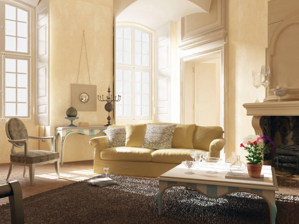 Modern stylish white living room with large windows and scandinavian style sofa against the backdrop of a fireplace and shelving and potted plants. Nobody.