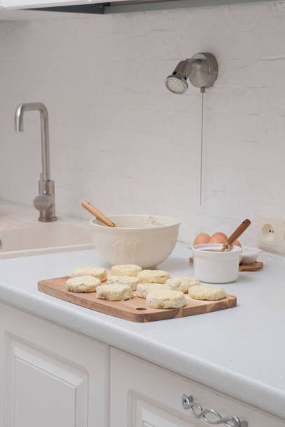 istock Preparing Cottage cheese fritters or sirniki on kitchen table. 2150865110