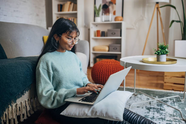 istock Female typing on laptop in modern home 2150865975