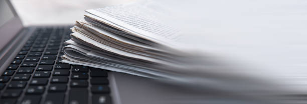 istock daily papers with news on the computer 2150866028