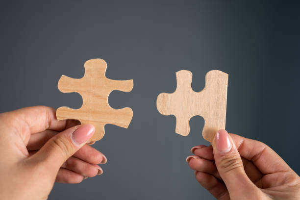 istock Woman holding puzzle pieces 2150866820