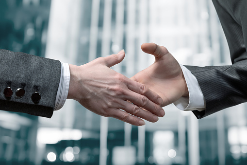 Concept of cooperation, conclusion of a deal or agreement between businessmen.