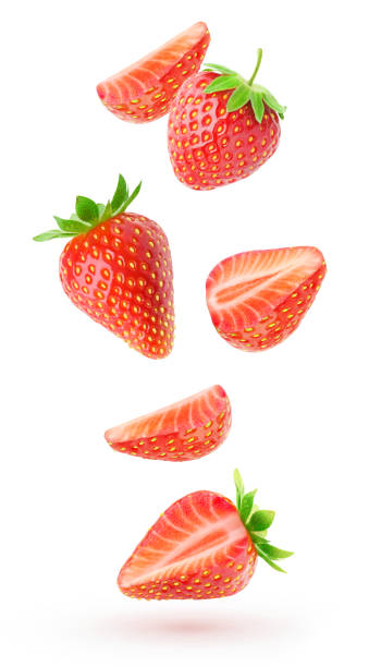 istock Cut strawberries levitation isolated on white background 2150872950