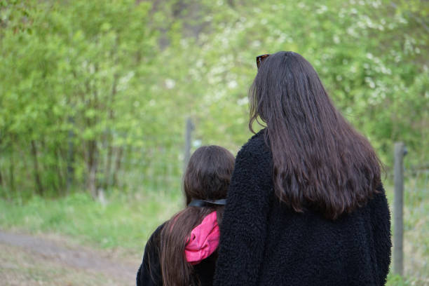 istock Rear view of two persons outdoors 2150876437