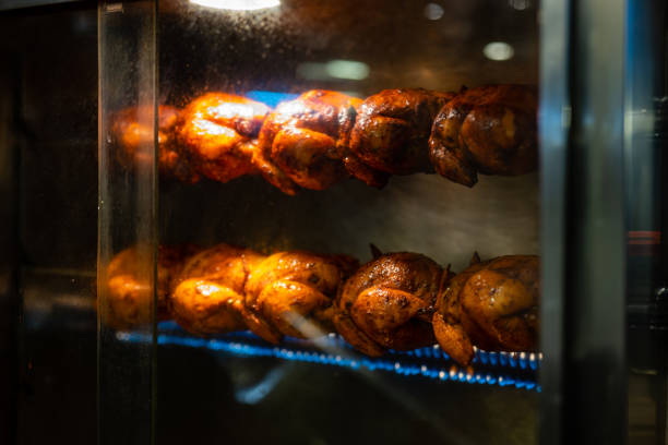 istock Grill Rotisserie Chicken Getting Kissed by Flame 2150877047