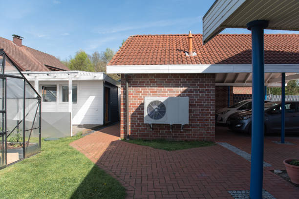 Air Source heat pump fitted outside a new home development stock photo